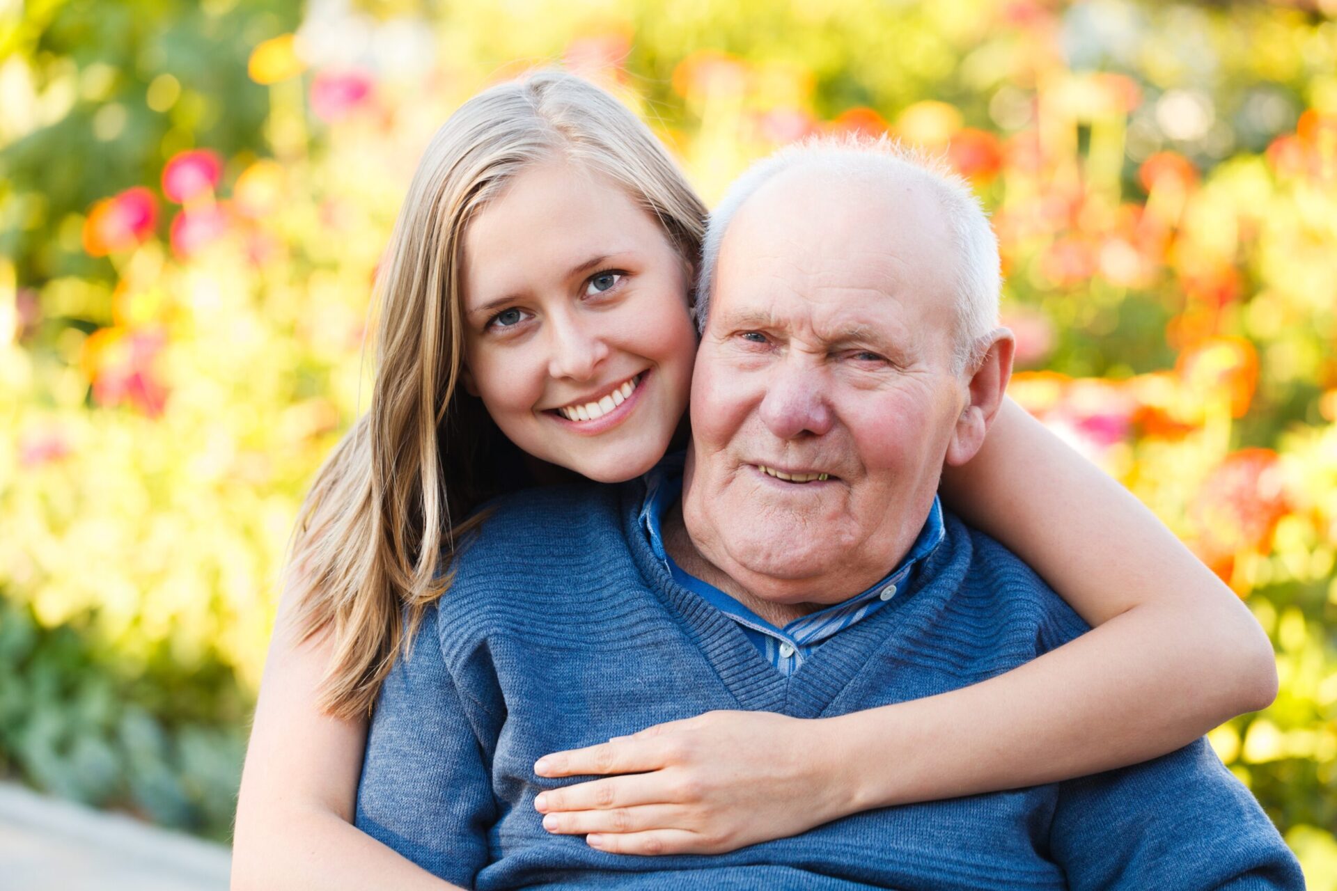 Beautiful granddaughter visiting her elderly kind grandfather.
